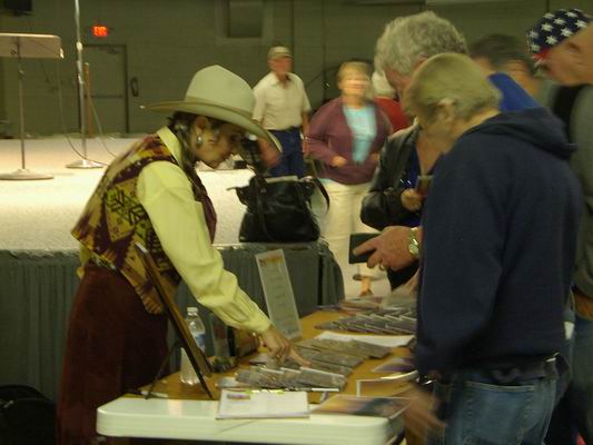 Belinda graciously signing autographs after concert at the Q