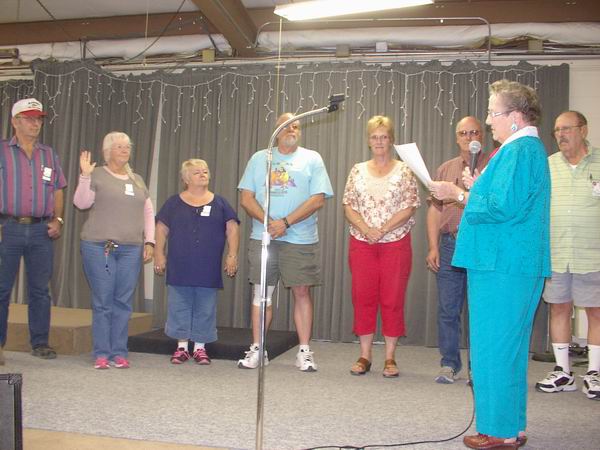 Arlea swearing in Charlene as Secretary