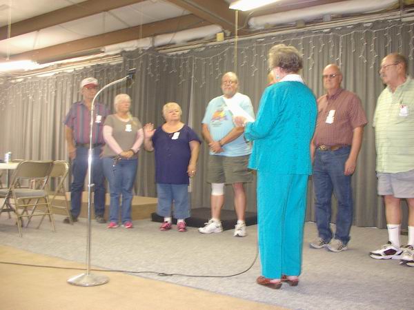 Arlea swearing in Pat as the QIA Treasurer