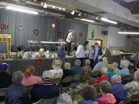 Various Volunteers coming up or awaiting their Gift from the Vendors!